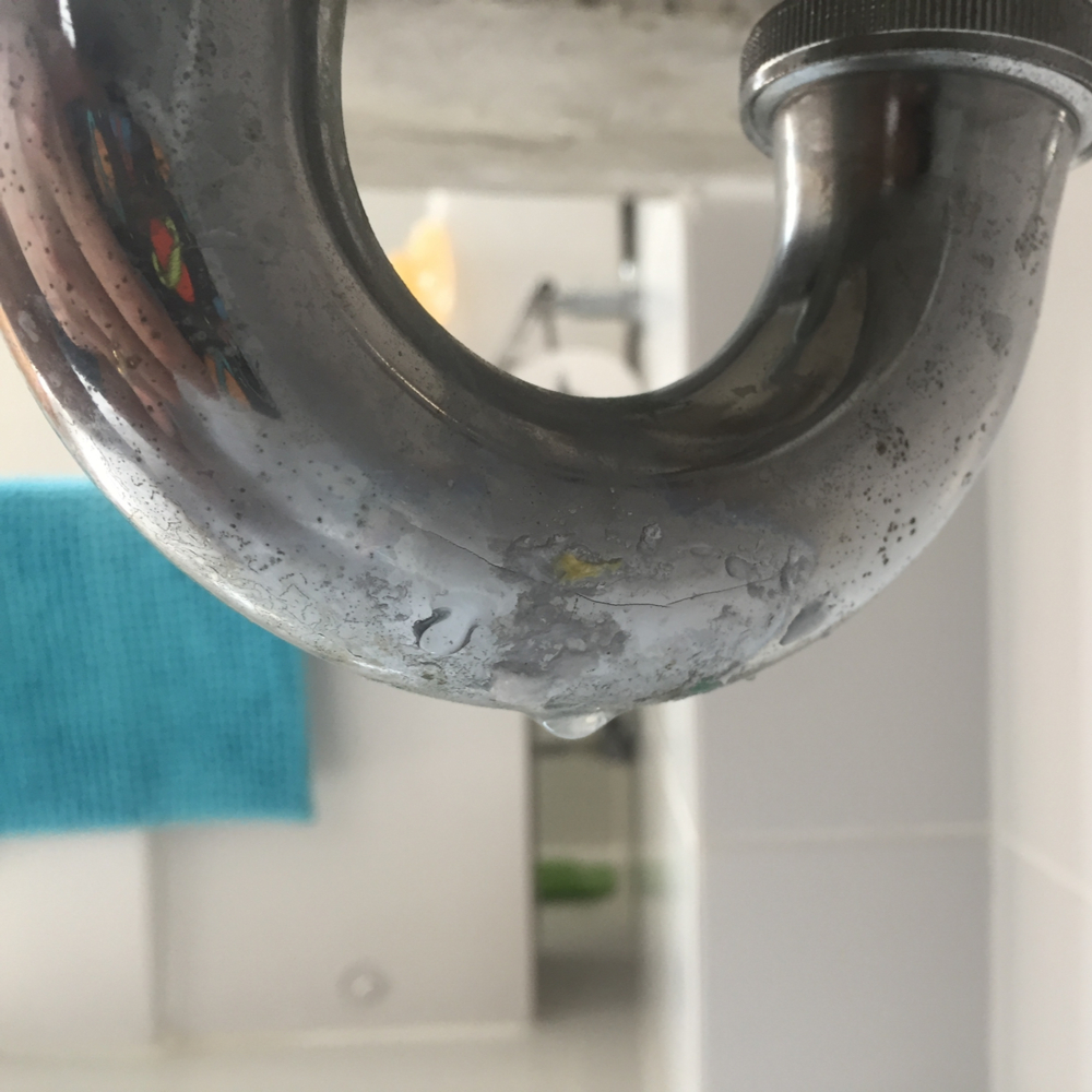 J&R Restoration leak detection service technician inspecting a property